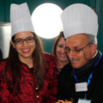 En photo : Amel Karboul portant une toque de cuisine au Salon du tourisme (MIT) 2014